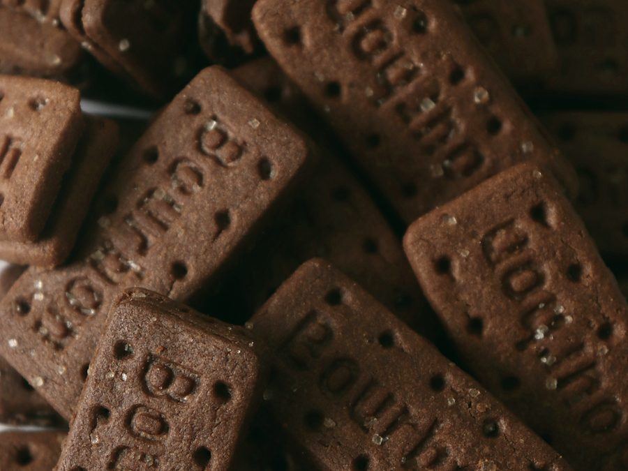 Chocolate sandwich biscuits stacked close up