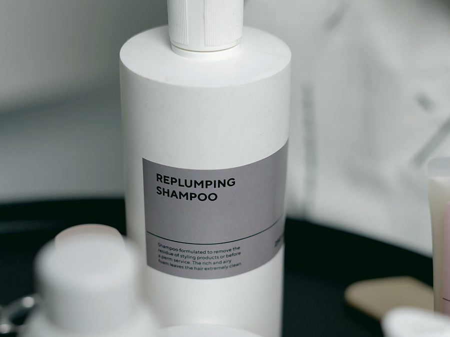 Shampoo and conditioner bottles awaiting fragrance dosing